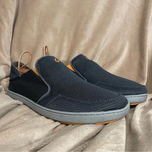 OluKai Men's Nohea Black Slip-On Mesh Sneakers with Dark Shadow.